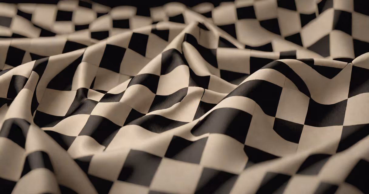 A checkered flag waving at a race finish line