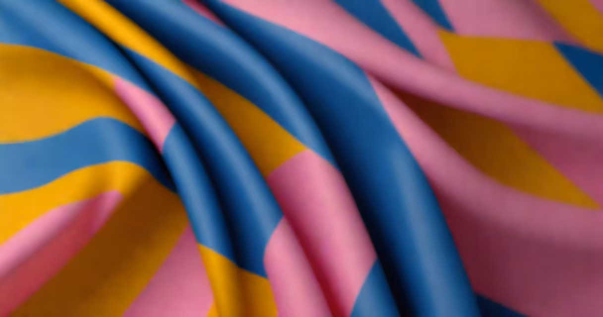 A close-up of the blue yellow and pink flag waving in the wind