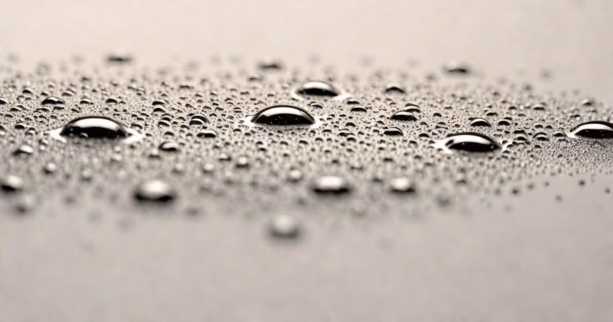 Close-up of skin pores with sweat droplets under a microscope